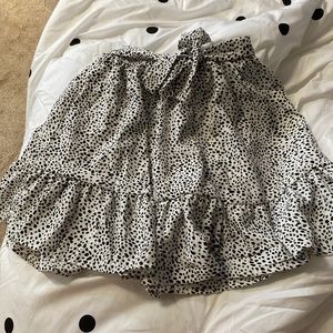 Flowy skirt , w tie.